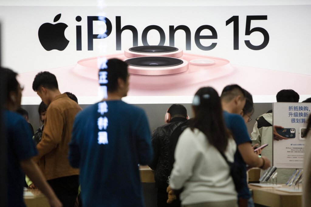 This photo taken on October 30, 2023 shows a poster for the new iPhone 15 at an Apple store in Shenyang, in China's northeastern Liaoning province. (Photo by AFP) / China OUT